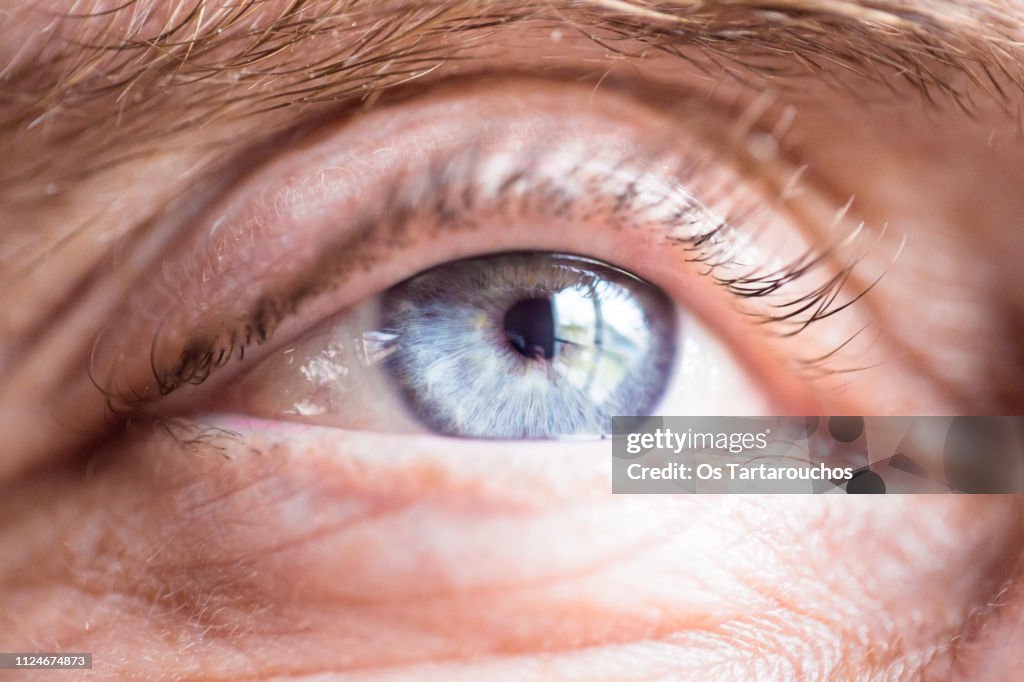 Blue eye close up of an old man