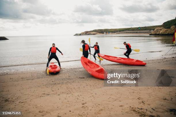 getting ready to kayak - dragging stock pictures, royalty-free photos & images