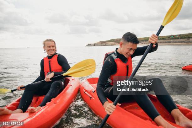 kayaks bumping into each other - k1 kayaking stock pictures, royalty-free photos & images