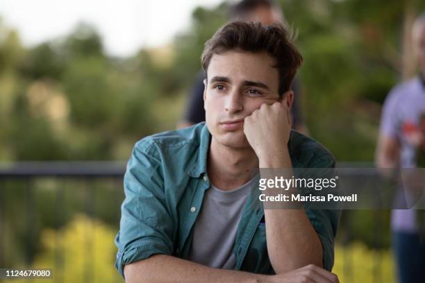 young man looks bored - bores stock pictures, royalty-free photos & images