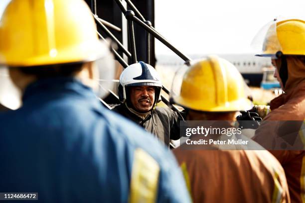 firemen training, firemen listening to supervisor, over the shoulder view - international firefighters day 個照片及圖片檔