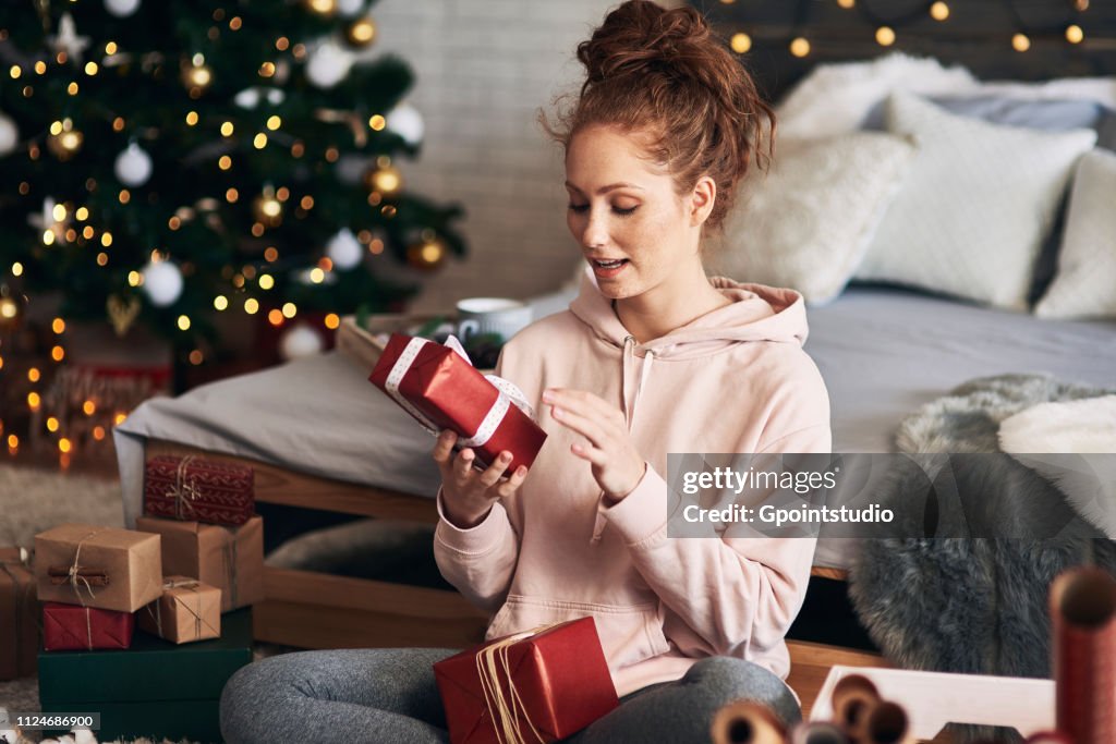 Woman wrapping Christmas presents