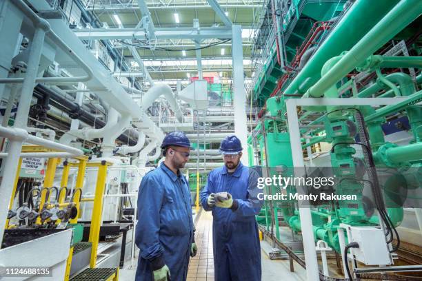 engineers in turbine hall in nuclear power station - turbine hall stock pictures, royalty-free photos & images