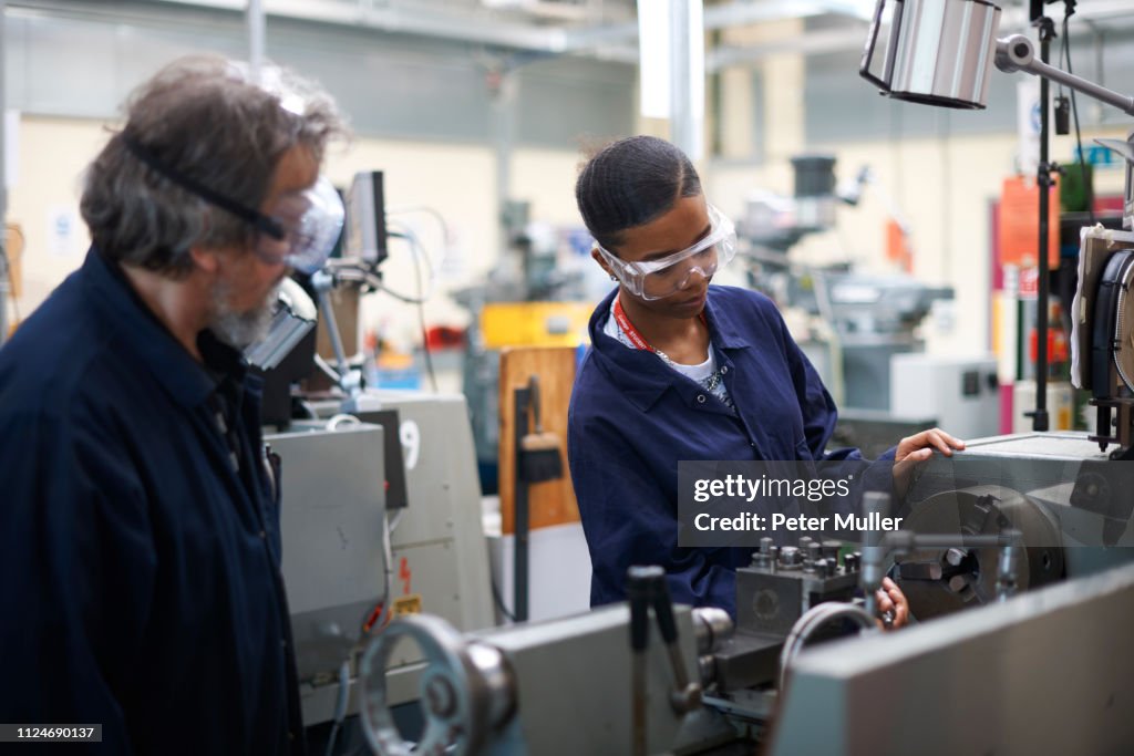 Machine Student Lecturer Teaching Student To Operate Machine In Workshop High-Res Stock ...