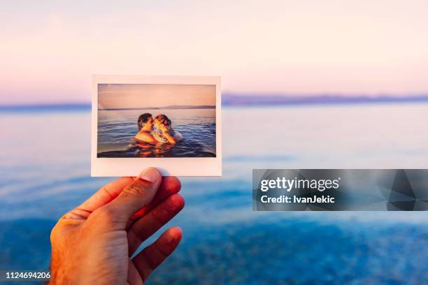 reviving dear memories of a family vacation - nostalgia stock pictures, royalty-free photos & images
