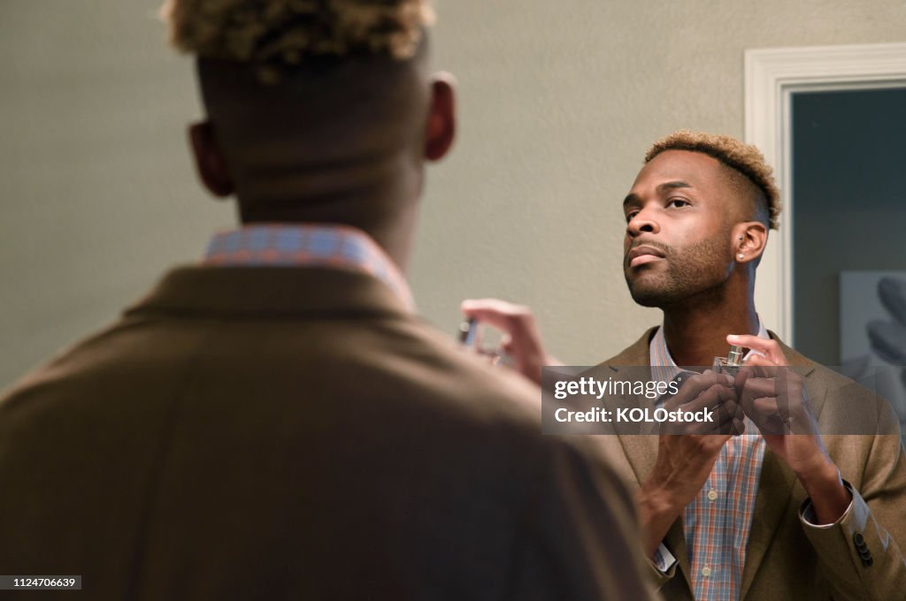 Man applying aftershave