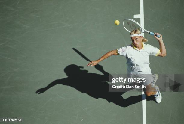Martina Navratilova of the United States serves to Steffi Graf of Germany during their Women's Singles Semi-Final match of the US Open Tennis...