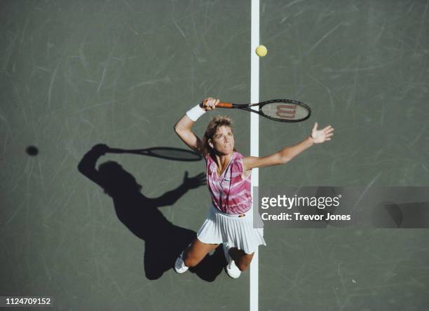 Chris Evert- Lloyd of the United States serves to Claudia Kohde-Kilsch during their Women's Singles Quarter-Final match of the US Open Tennis...