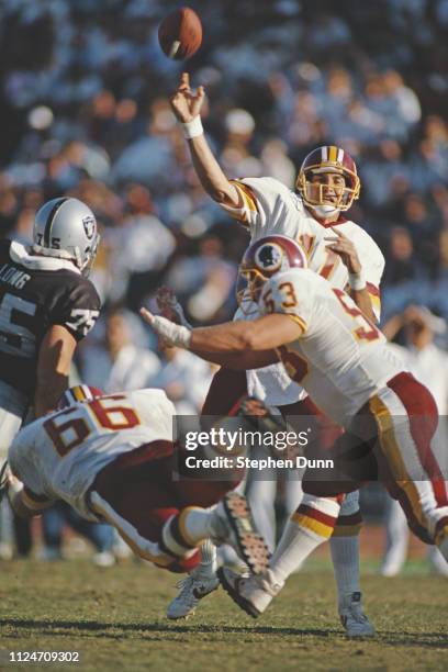 Mark Rypien, Quarterback for the Washington Redskins throws the ball downfield during the National Football Conference West game against the Los...