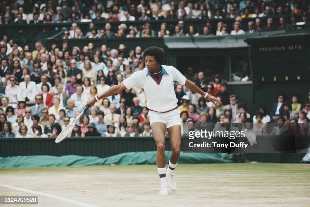 Arthur Ashe of the United States makes a backhand return to Jimmy Connors on his way to winning the Men's Singles Final match at the Wimbledon Lawn...