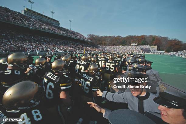 Officer cadets from the United States Military Academy at West Point greet their team before the start of the NCAA Division 1-A Army-Navy college...