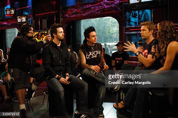 Dave Buckner, Jerry Horton and Jacoby Shaddix of Papa Roach with Fuse VJs Steven and Marianela