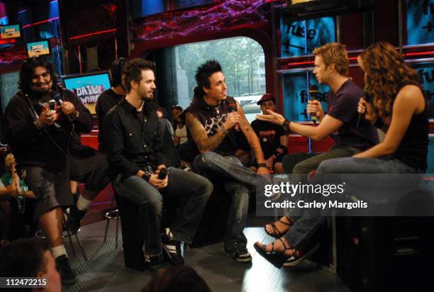 Dave Buckner, Tobin Esperance, Jerry Horton and Jacoby Shaddix of Papa Roach with Fuse VJs Steven and Marianela