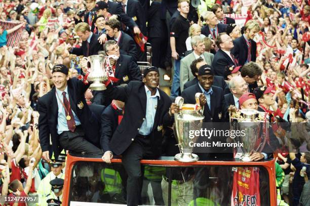 Manchester United celebrate winning the treble as the jubilant team make their way through Manchester during an open top bus parade. Teddy...