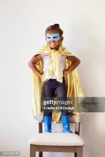 portrait of little girl dressing up as a superhero - menina fantasia bonita imagens e fotografias de stock