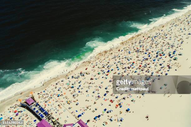 aerial view of a crowded beach during fourth july weekend, jersey shore, new jersey, united states - new jersey beach stock pictures, royalty-free photos & images