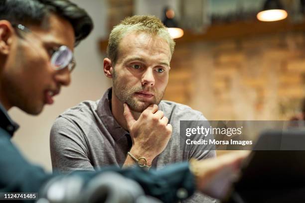 businessman explaining colleague during meeting - innovation 協力する ストックフォトと画像