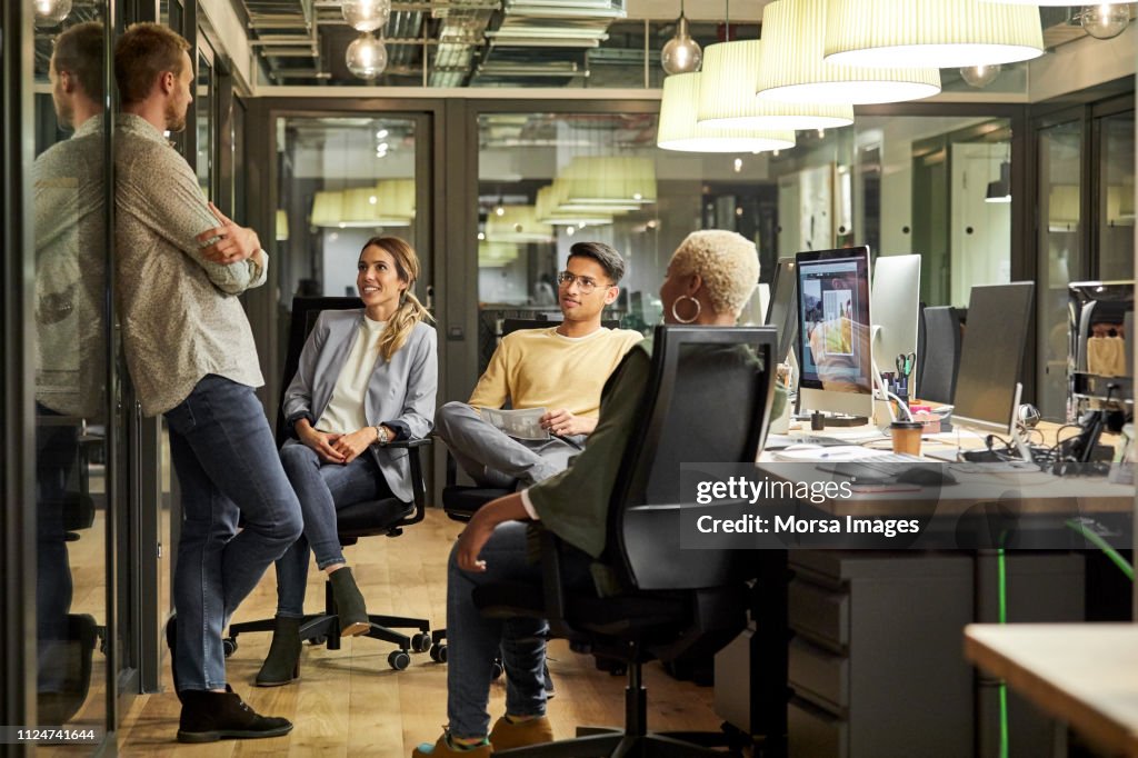 Business people discussing in creative office