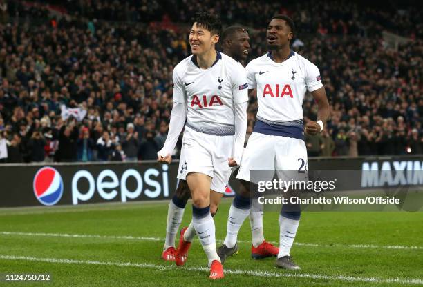 Heung-Min Son of Tottenham celebrates scoring the opening goal with Serge Aurier during the UEFA Champions League Round of 16 First Leg match between...