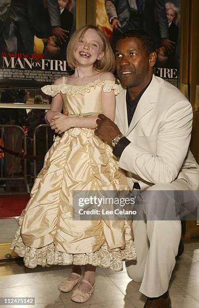 Dakota Fanning and Denzel Washington during "Man on Fire" - Los Angeles Premiere - Red Carpet at Mann Village Westwood in Westwood, California,...