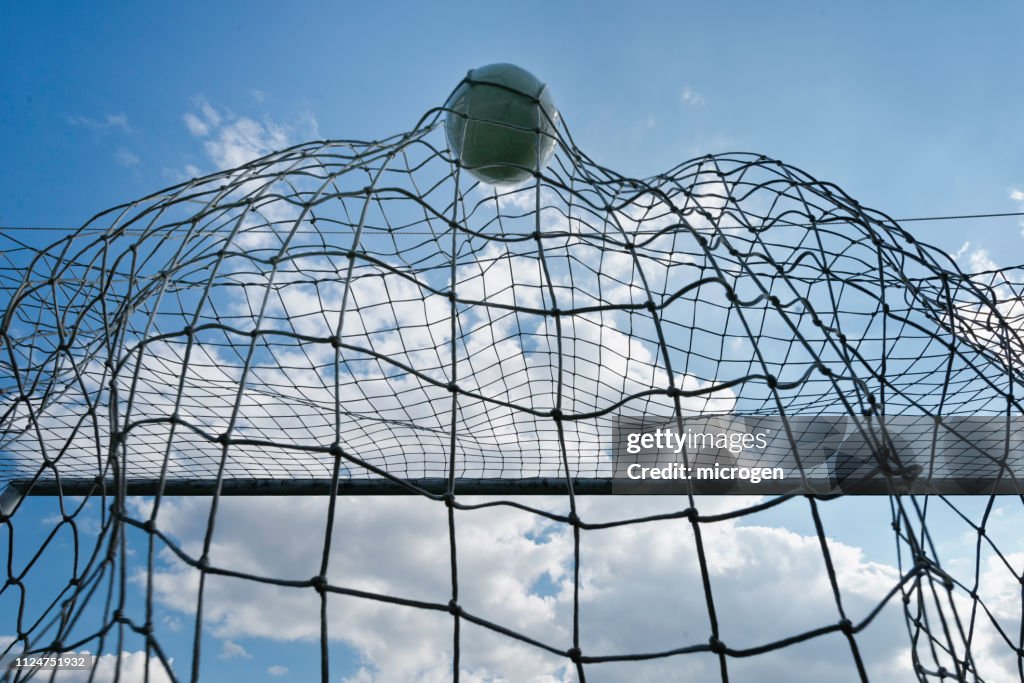 Low Angle View Of Soccer Ball In Goal Post