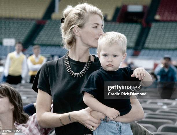 October 1996: Supermodel Elaine Irwin - Mellencamp and Son Hud Mellencamp backstage during Farm Aid at William - Brice Stadium in Columbia, SC. On...