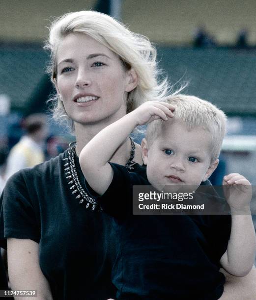 October 1996: Supermodel Elaine Irwin - Mellencamp and Son Hud Mellencamp backstage during Farm Aid at William - Brice Stadium in Columbia, SC. On...