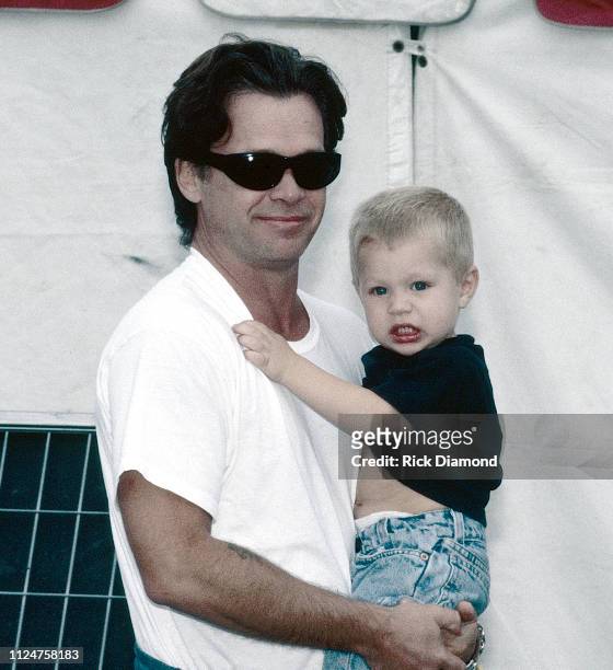 October 1996: Singer/Songwriter John Mellencamp and Son Hud Mellencamp backstage during Farm Aid at William - Brice Stadium in Columbia, SC. On...