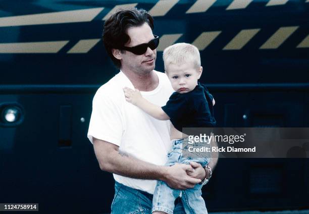 October 1996: Singer/Songwriter John Mellencamp and Son Hud Mellencamp backstage during Farm Aid at William - Brice Stadium in Columbia, SC. On...