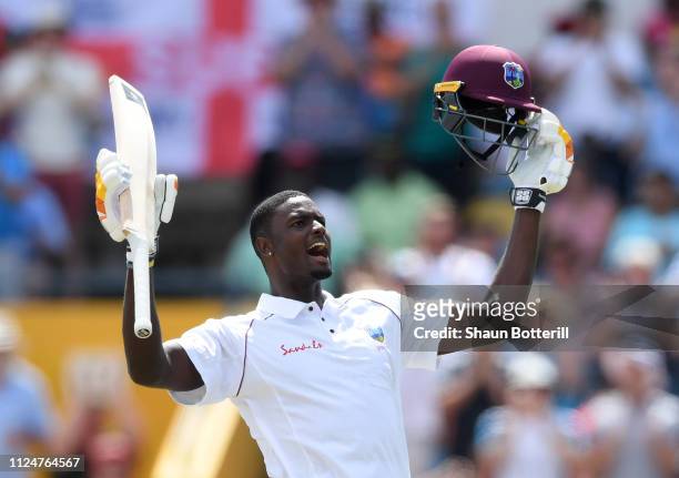 West Indies captain Jason Holder celebrates reaching his 100 during Day Three of the First Test match between England and West Indies at Kensington...