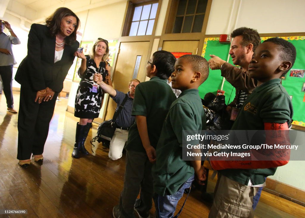 California Attorney General Kamala Harris, left, talks with students
