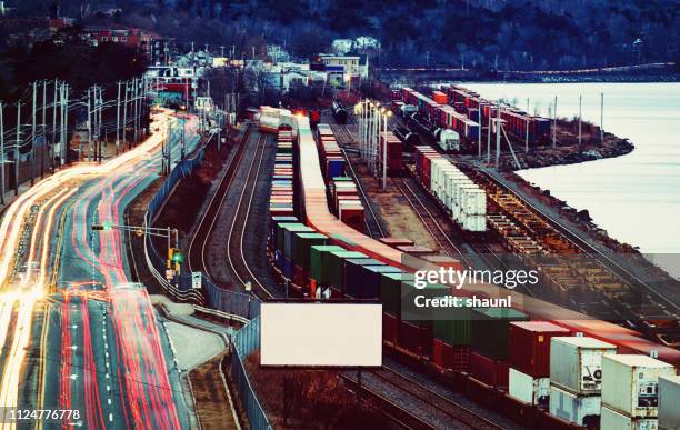 rail & road traffic - train yard at night stock pictures, royalty-free photos & images