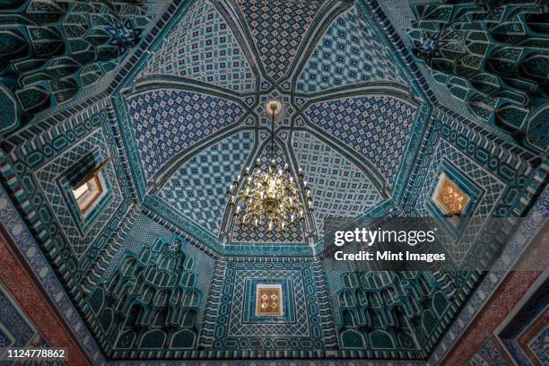 interior, mosaic patterns in a dome of a madrasa building in samarkand. - chandelier stock pictures, royalty-free photos & images