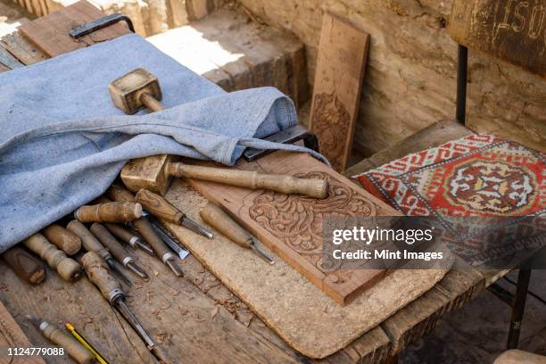 high angle close up of traditional woodworking tools, khiva, uzbekistan. - frieze stock pictures, royalty-free photos & images