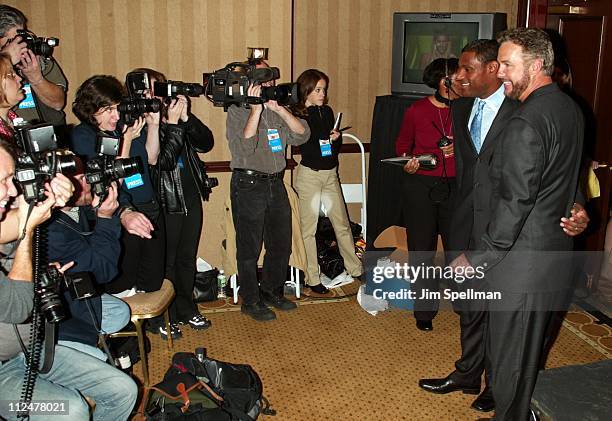 Sammy Sosa and William Petersen being photographed by the press