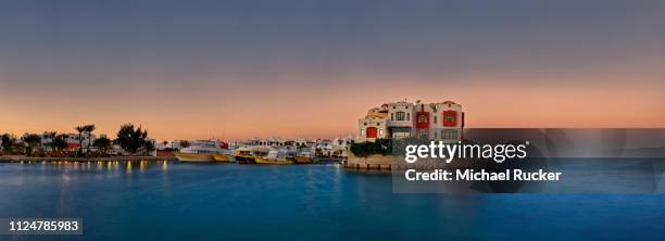 boat port with small peninsula at sunset, blue water dive resort, hurghada, red sea, egypt - egypt beach stock pictures, royalty-free photos & images