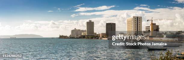 waterfront and buildings in downtown kingston jamaica - kingston stock pictures, royalty-free photos & images