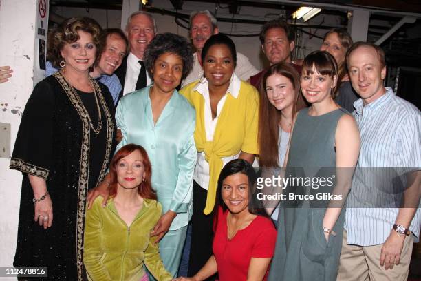 Talk show host Oprah Winfrey poses backstage with the cast of the Pulitzer Prize-winning play "August: Osage County", including actresses Phylicia...