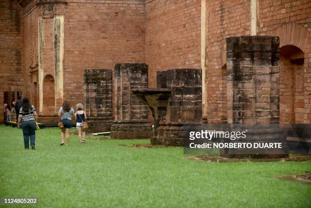 Tourists visit the ruins of the Jesus de Tavarangue Jesuit mission, 412 km south of Asuncion, on January 18, 2019. - Paraguay is proposing the...