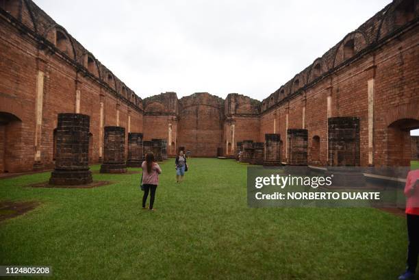 Tourists visit the ruins of the Jesus de Tavarangue Jesuit mission, 412 km south of Asuncion, on January 18, 2019. - Paraguay is proposing the...