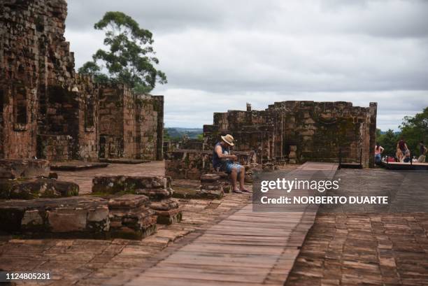 Tourists visit the ruins of the Jesus de Tavarangue Jesuit mission, 412 km south of Asuncion, on January 18, 2019. - Paraguay is proposing the...