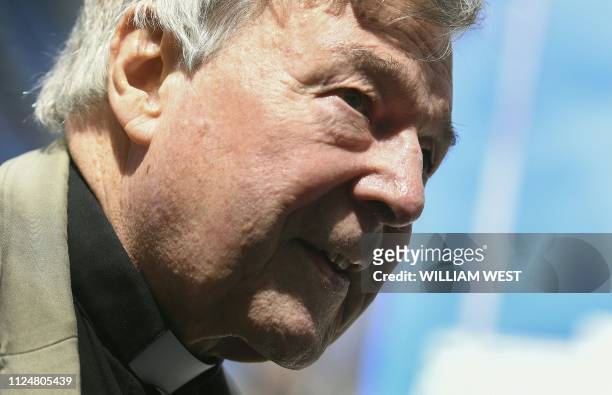 Cardinal George Pell walks from a car in Melbourne on February 14, 2019. - Pell is facing prosecution for historical child sexual offences.