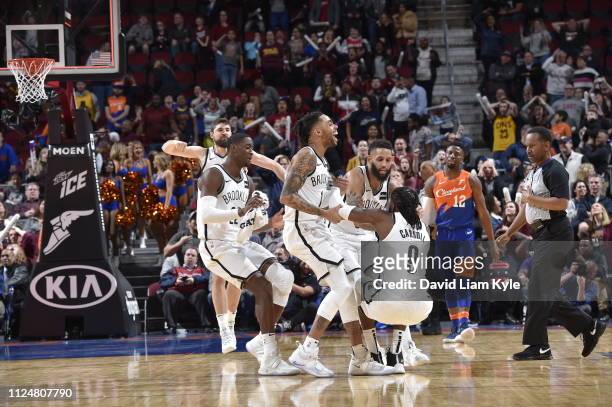 The Brooklyn Nets react after DeMarre Carroll of the Brooklyn Nets shoots the ball to send the game into triple overtime against the Cleveland...