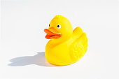 A yellow rubber duck on a white background