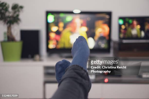 person watching tv - part of a series stock pictures, royalty-free photos & images