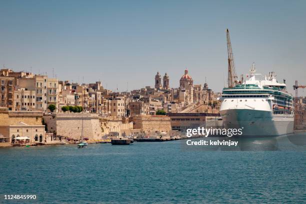 cruise ship visiting the ancient city of valletta, malta - malta harbour stock pictures, royalty-free photos & images
