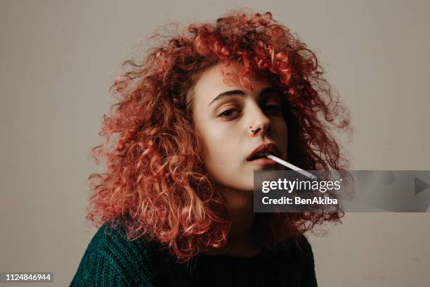 gen z girl smoking a cigarette - beautiful women smoking cigarettes stock pictures, royalty-free photos & images