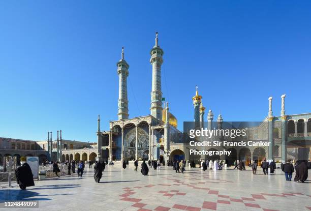 golden dome, minarets and courtyard of "hazrat-e masumeh" shrine ("fatima masumeh shrine") in holy city of qom, iran - qom stock pictures, royalty-free photos & images