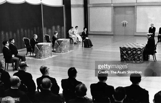 Emperor Hirohito, Empress Nagako, Crown Prince Akihito, Crown Princess Michiko and Prince Hitachi attend the 'Kosho-Hajime-no-Gi' first lecture of...
