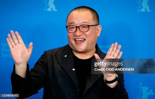 Chinese director, screenwriter and producer Wang Xiaoshuai poses during a photocall for the film "So long my son" presented in competition at the...